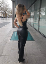 Load image into Gallery viewer, Black faux leather trousers with flattering ends
