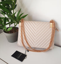 Load image into Gallery viewer, Cream clutch bag with golden chains
