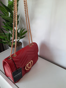 red clutch bag with the heart 
